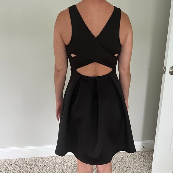 Express Dresses & Skirts - NWOT Express little lack dress pleated with cross/open back size 2